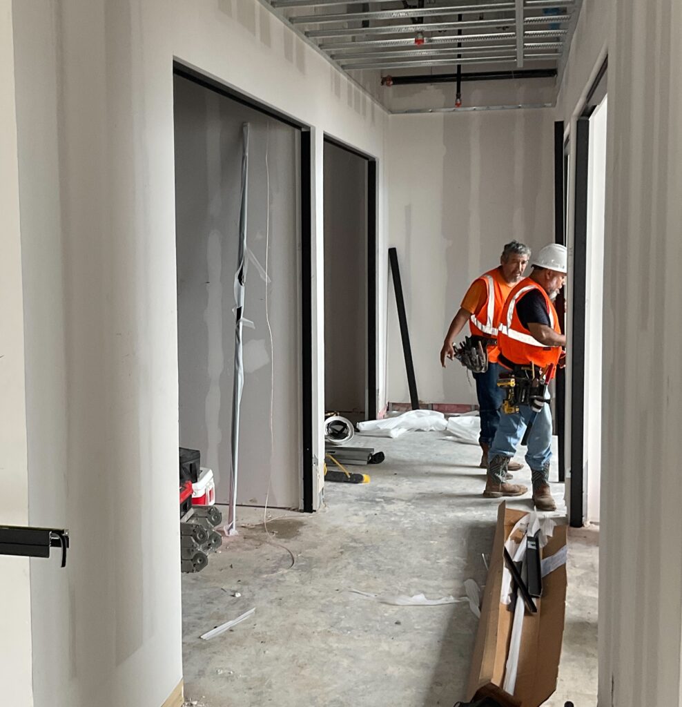 Trade partners working on the interior of The Birchman Office Building