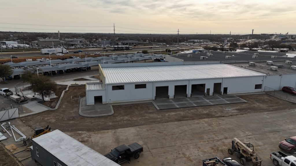 General contractor for auto dealership in Denton. Image shows exterior shot of expansion