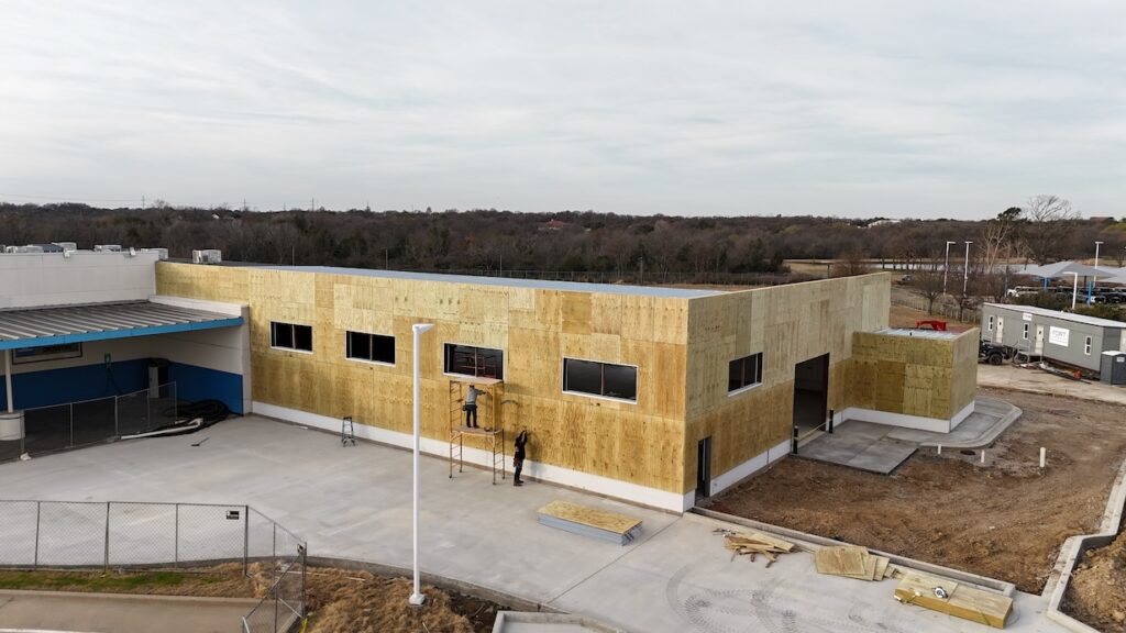 General contractor for auto dealership in Denton. Photo shows exterior work on expansion.