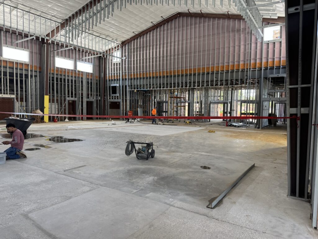 Leveling the gym floor at Emmanuel Chin Baptist Church in Lewisville, Texas
