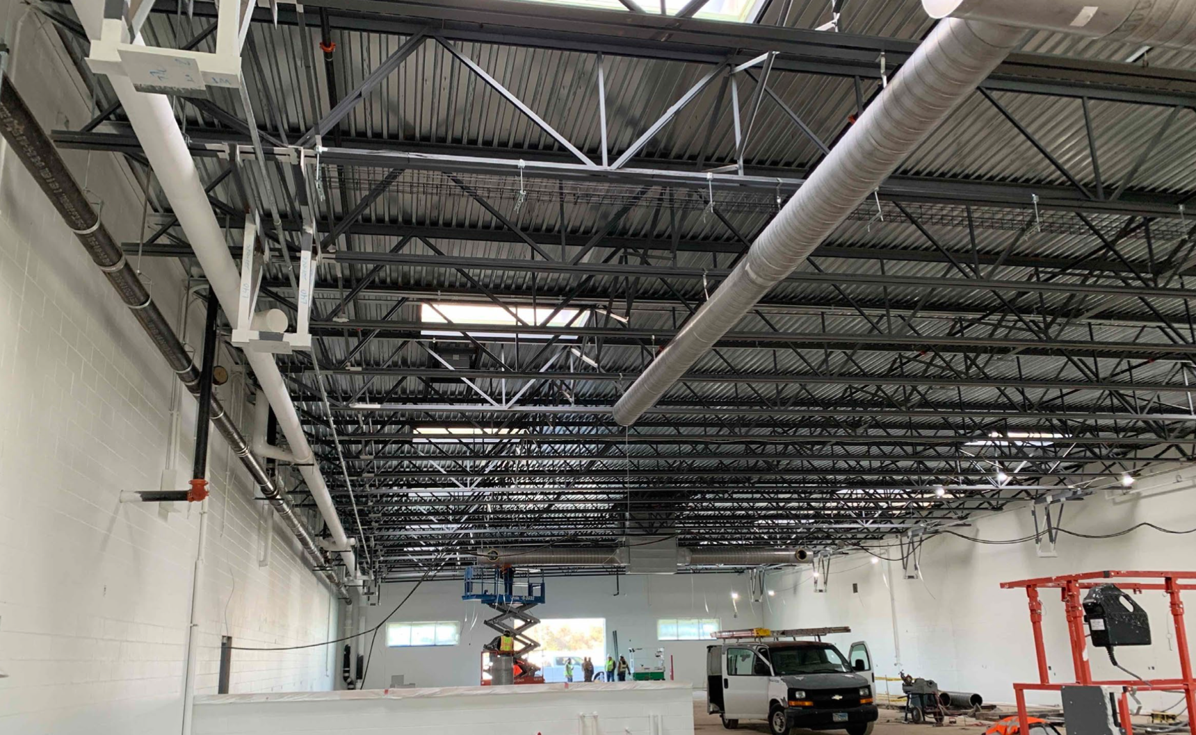 Ductwork being installed at Fort Worth Audi